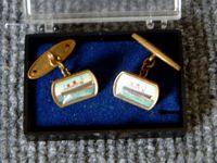 VERY EARLY SOUVENIR ITEM OF A PAIR OF CUFFLINKS FROM THE ORIGINAL VESSEL THE RMS QUEEN ELIZABETH